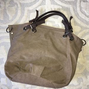 Green bag with brown handles